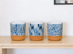 Set of Three Blue Terra Cotta And White Ceramic 1 Ounce Geometric Round Pot Planters