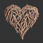 Heart-shaped wall art made of driftwood on a white background