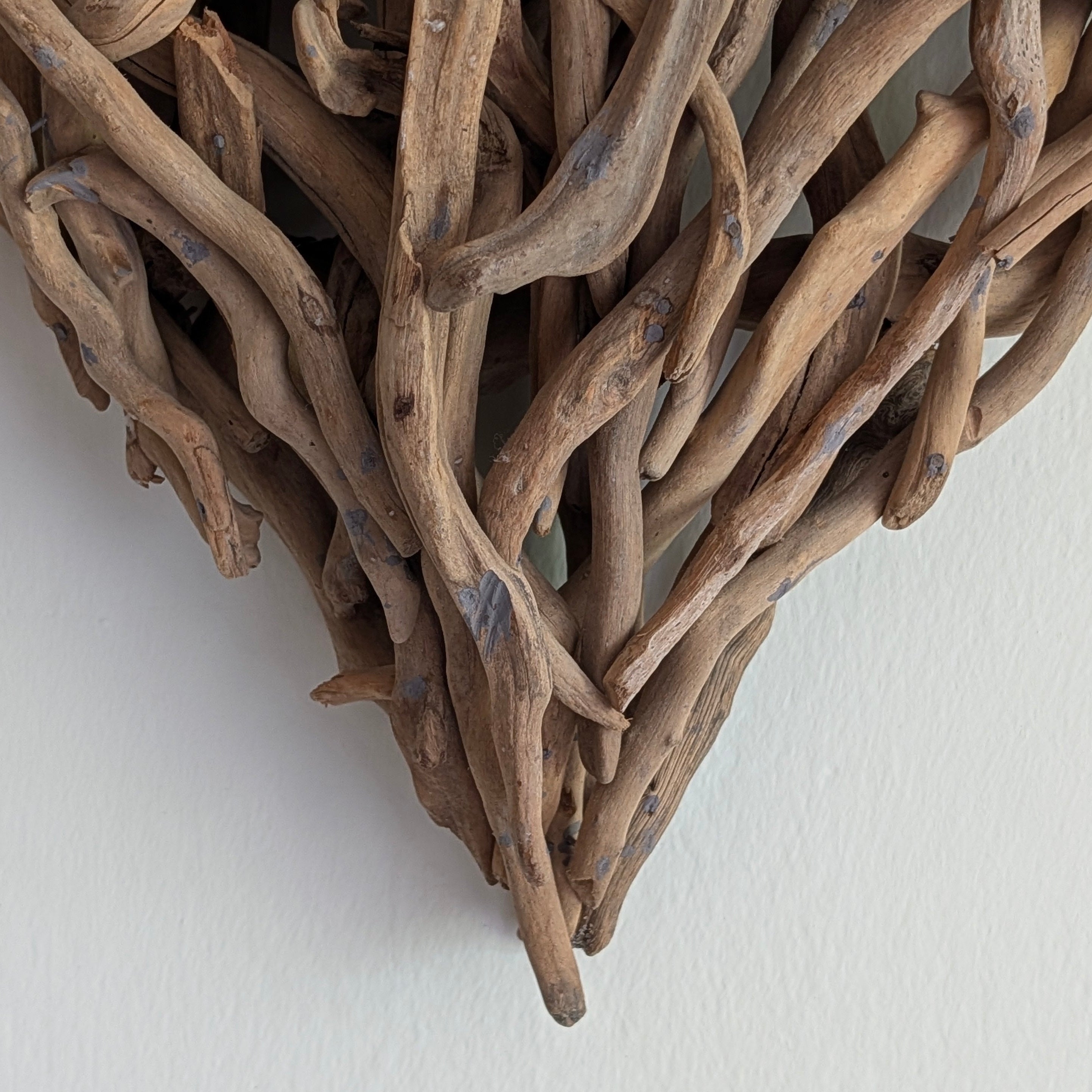 Driftwood art piece on a white background