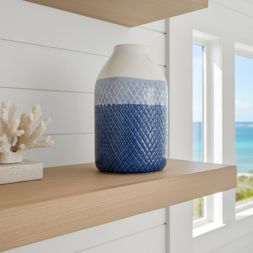 White and blue patterned vase on a white background
