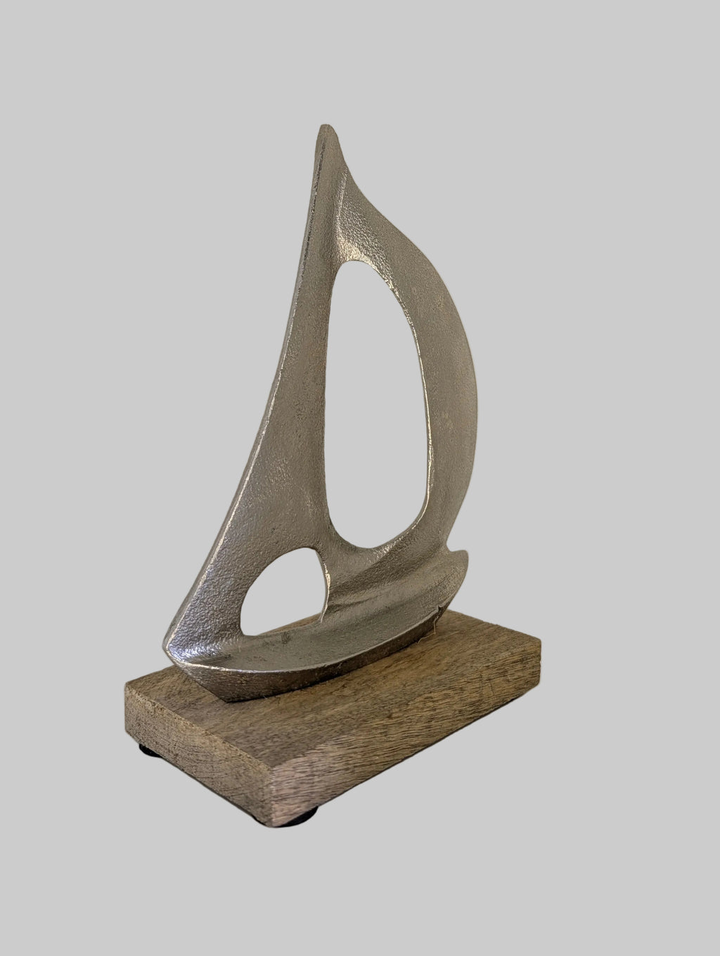 Abstract sculpture on a wooden base against a white background