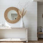 White textured vase on a white shelf
